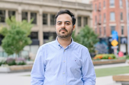 Man in front of buildings