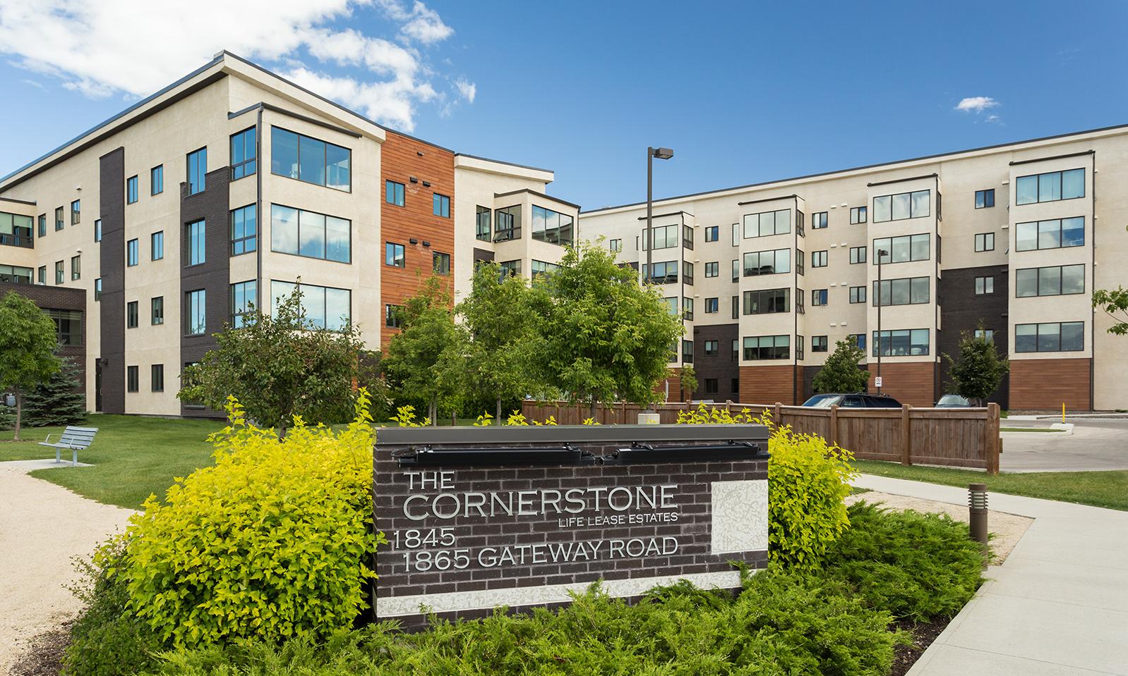 Cornerstone Life Lease Estates. Location plaque in foreground; the two Cornerstone buildings in the background. 
