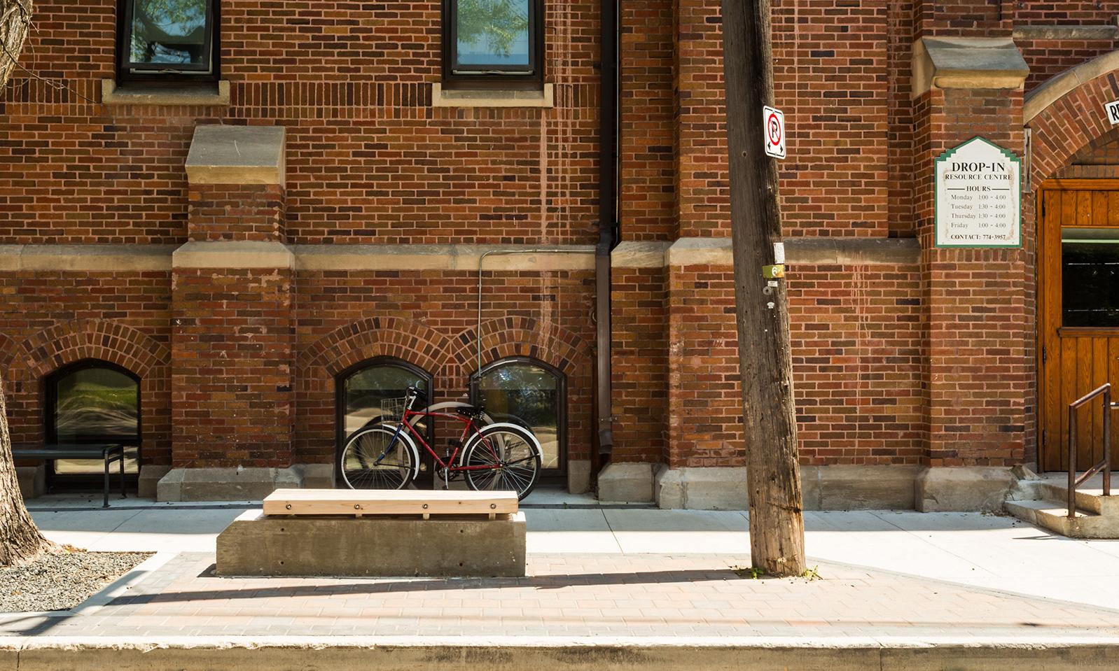 St. Matthew’s WestEnd Commons. Exterior side view of the building showing the sidewalk, bike rack and bench.